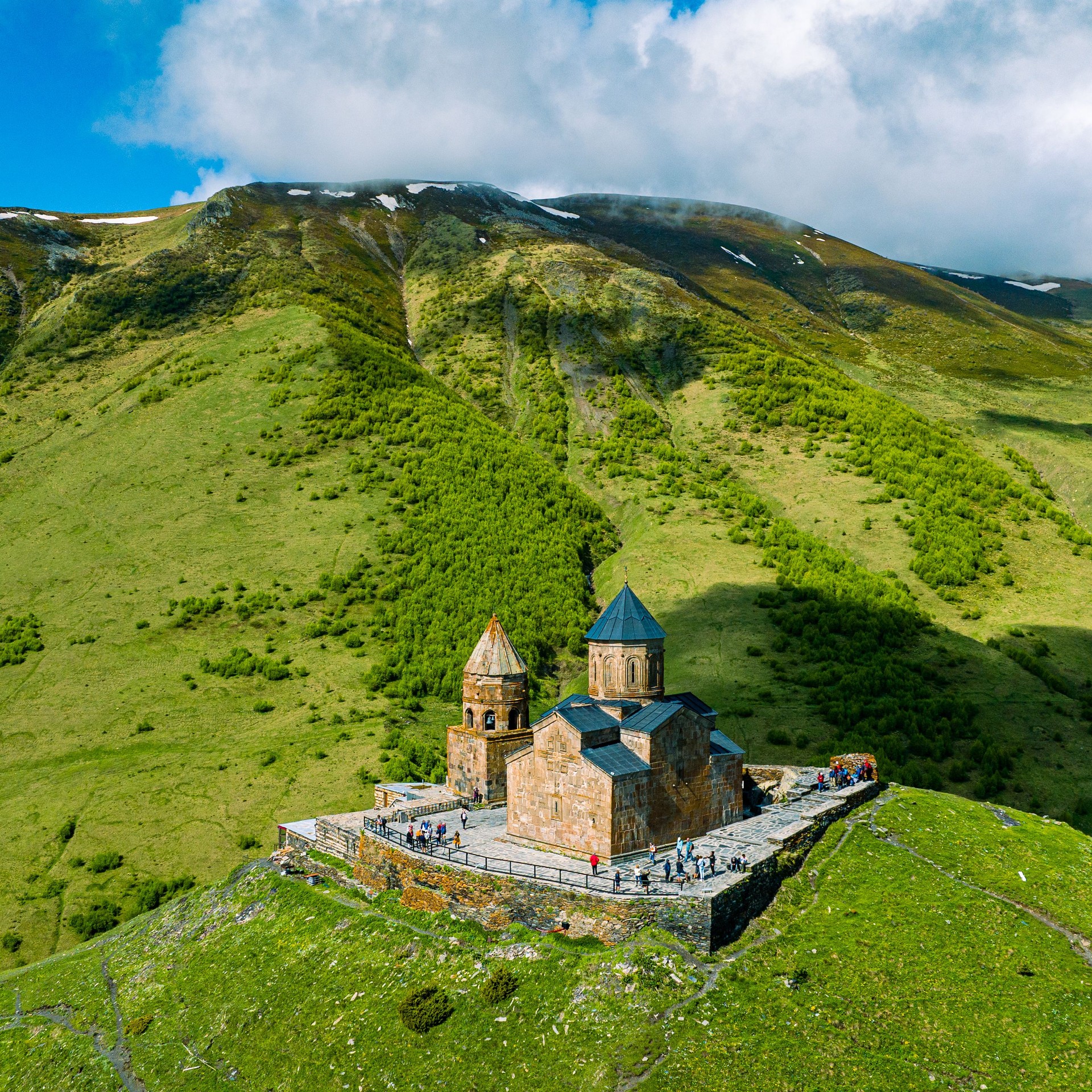 Gergeti Trinity Church against Caucasus mountains in Georgia
